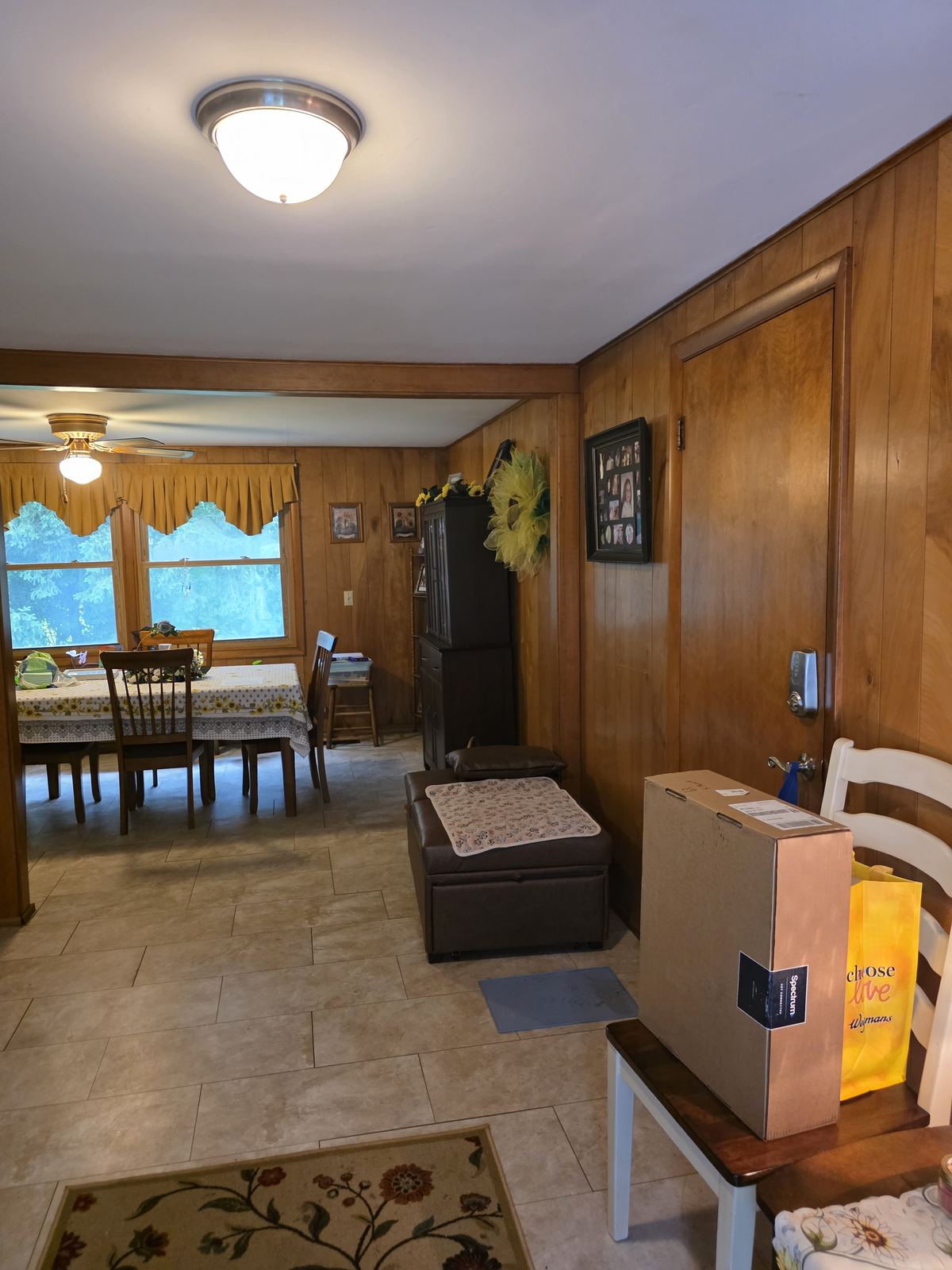 Wood-paneled dining and entry area